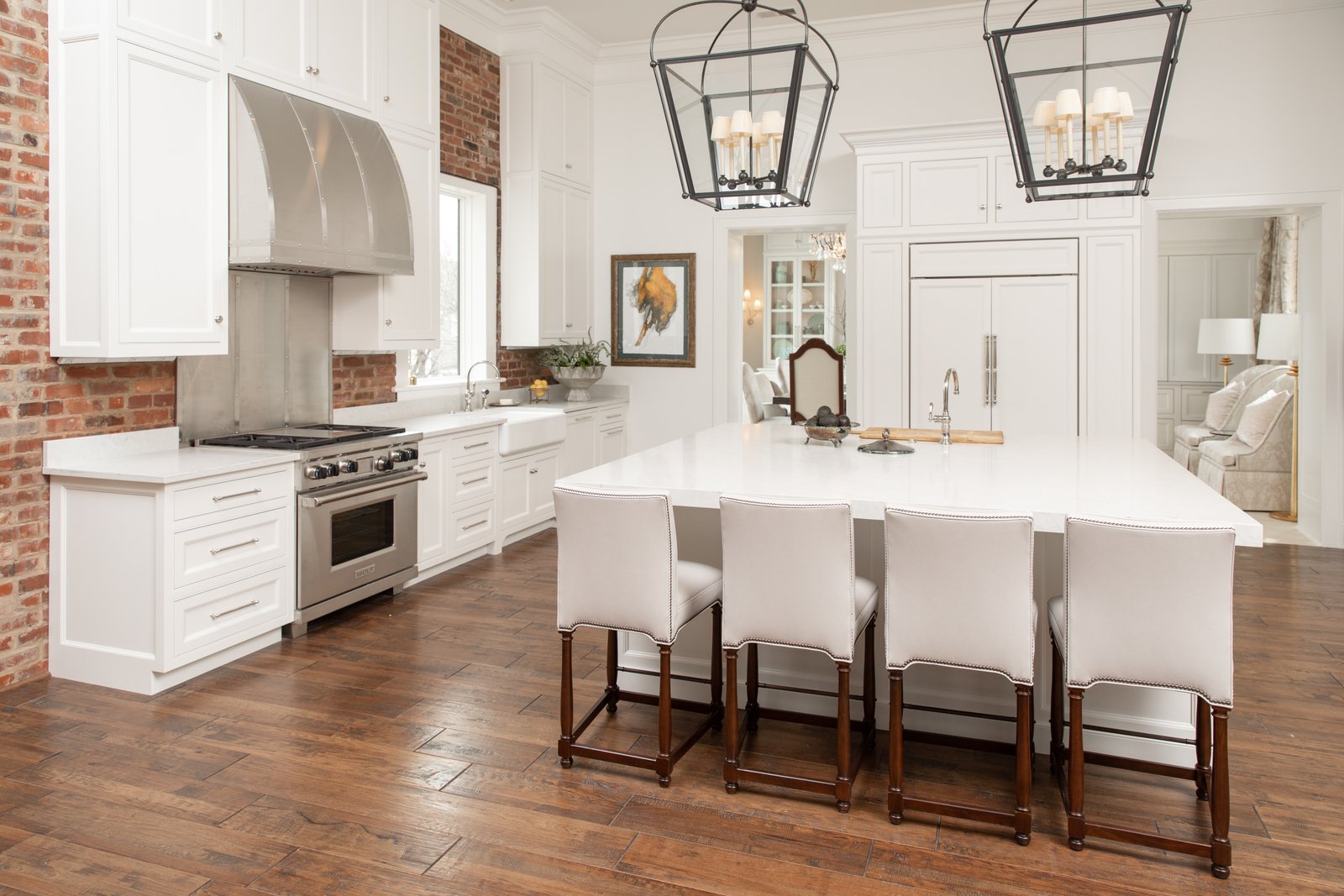Large white painted kitchen with 10-foot ceiling cabinets