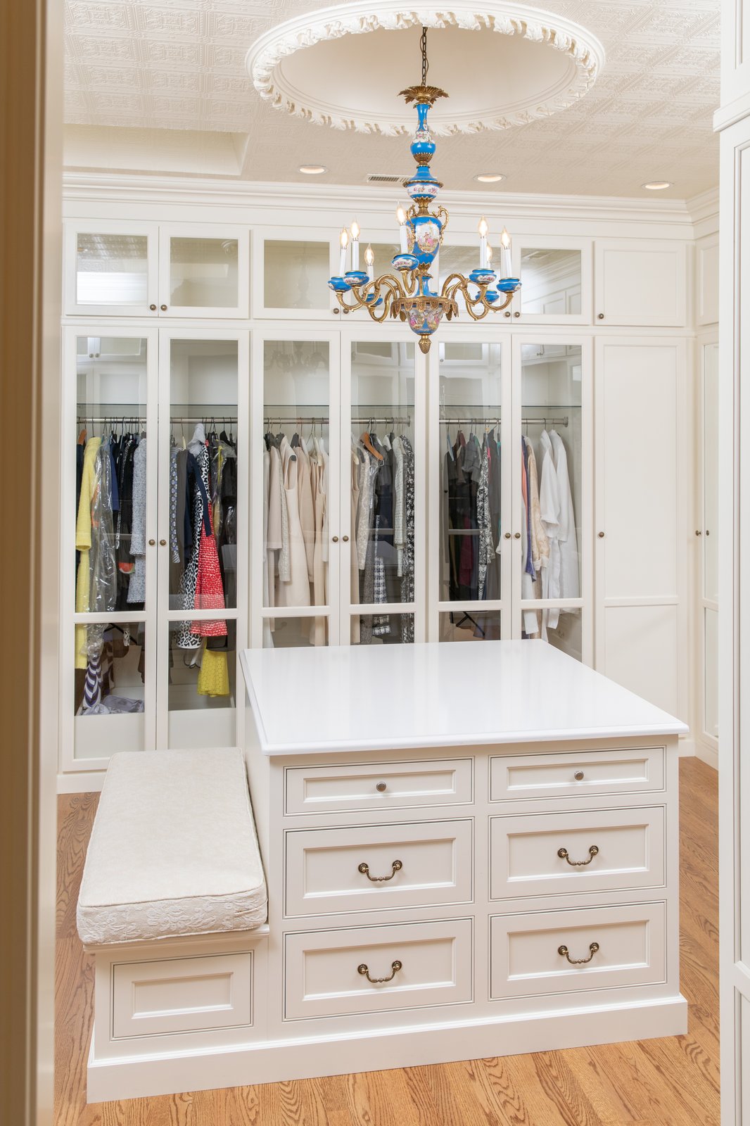 His and hers master closets — painted white and stained cherry wood