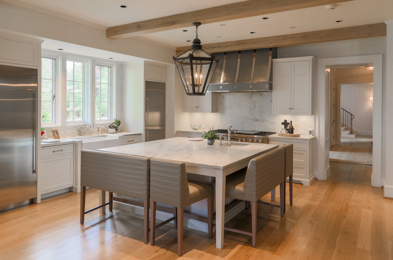 White minimalist kitchen with recessed panel shaker doors