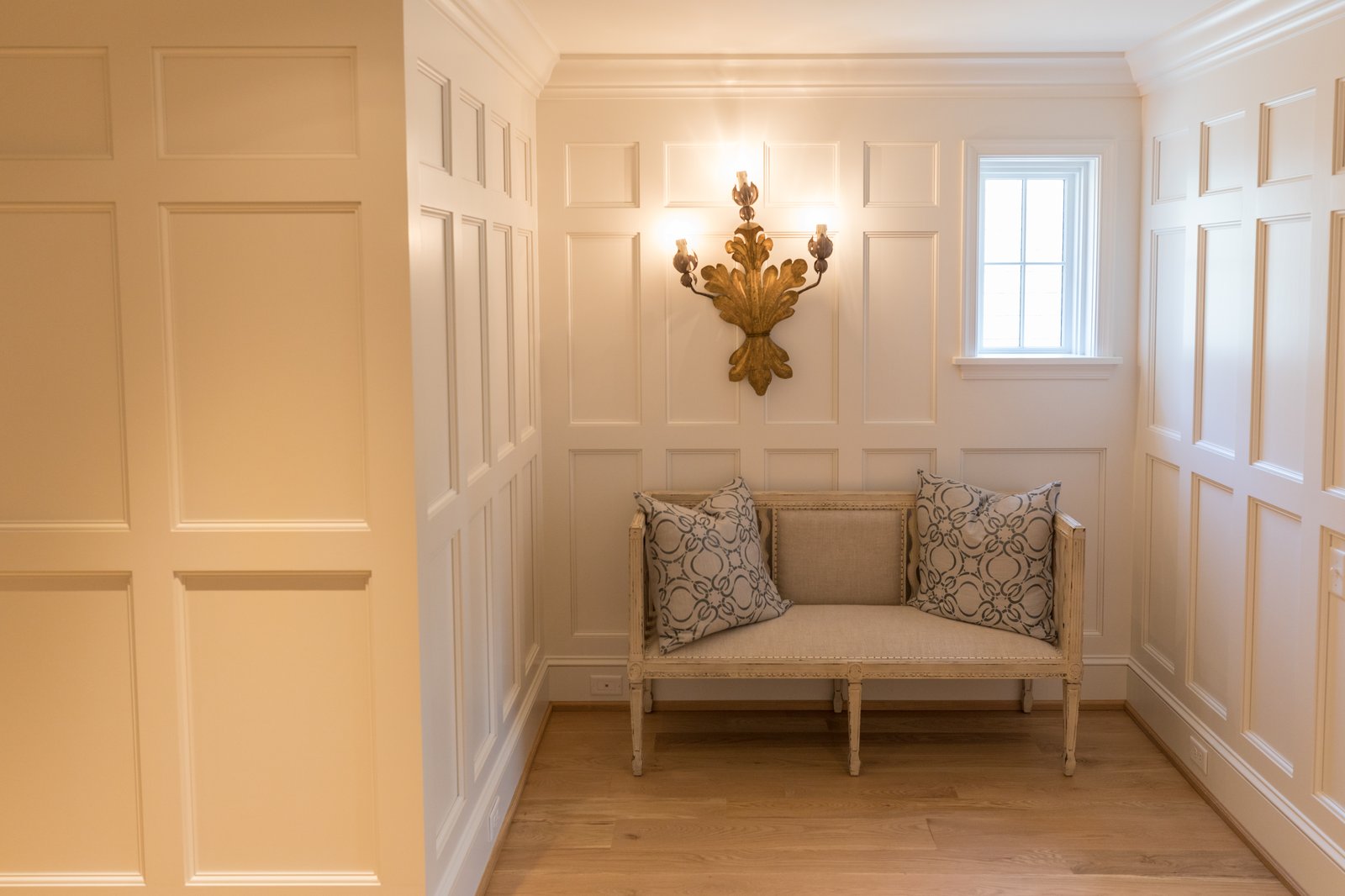 Built-in nook with floor to ceiling wainscot panels